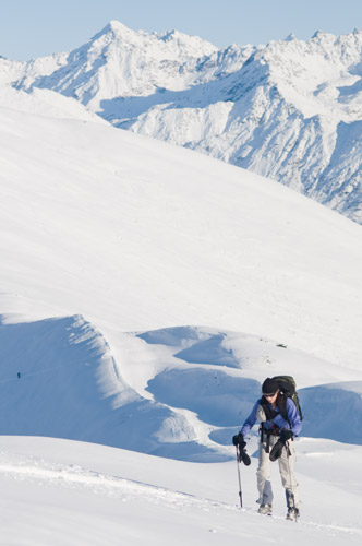Amy skinning on a ridgeline in the Talkeetna Mountains
